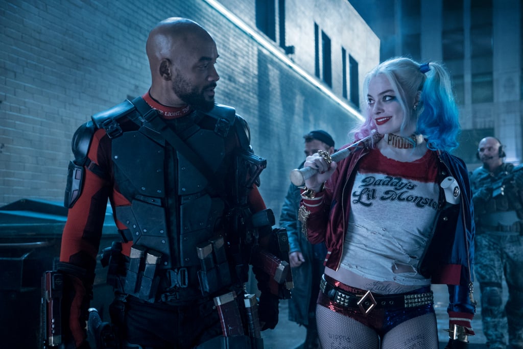 Deadshot and Harley Quinn share a knowing glance.