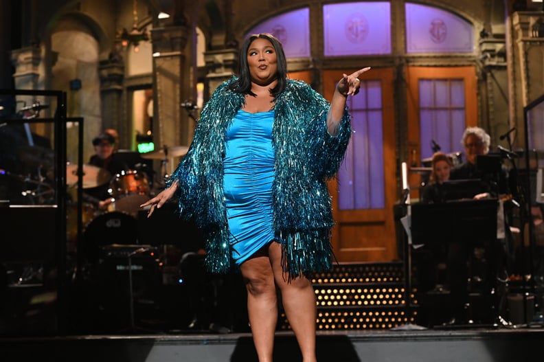 Lizzo's Metallic Blue Minidress and Fringe Coat on "SNL"