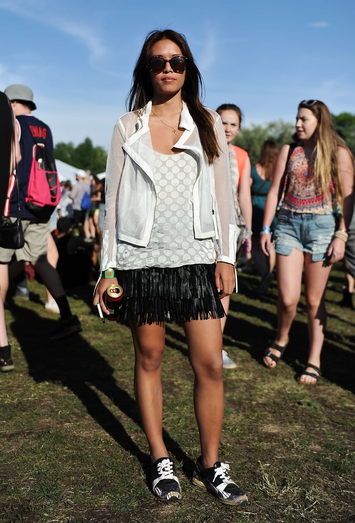 This festivalgoer embraced the season's fringe trend with a black miniskirt that she paired with a mesh jacket, Zimmermann top, and Kenzo shoes.