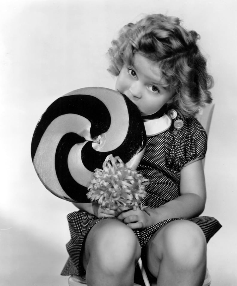 BRIGHT EYES, Shirley Temple, 1934, eating a big lollipop