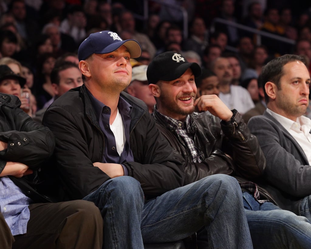 With Leonardo DiCaprio at a Lakers game in 2011.