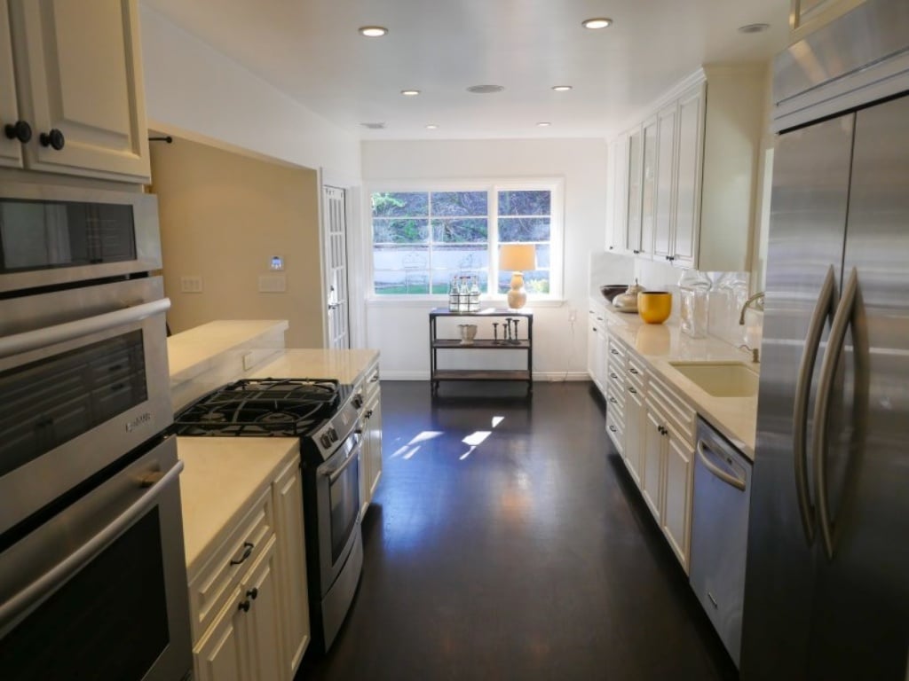 Dark hardwood floors balance out the white walls. 
 Source: Sotheby's Realty