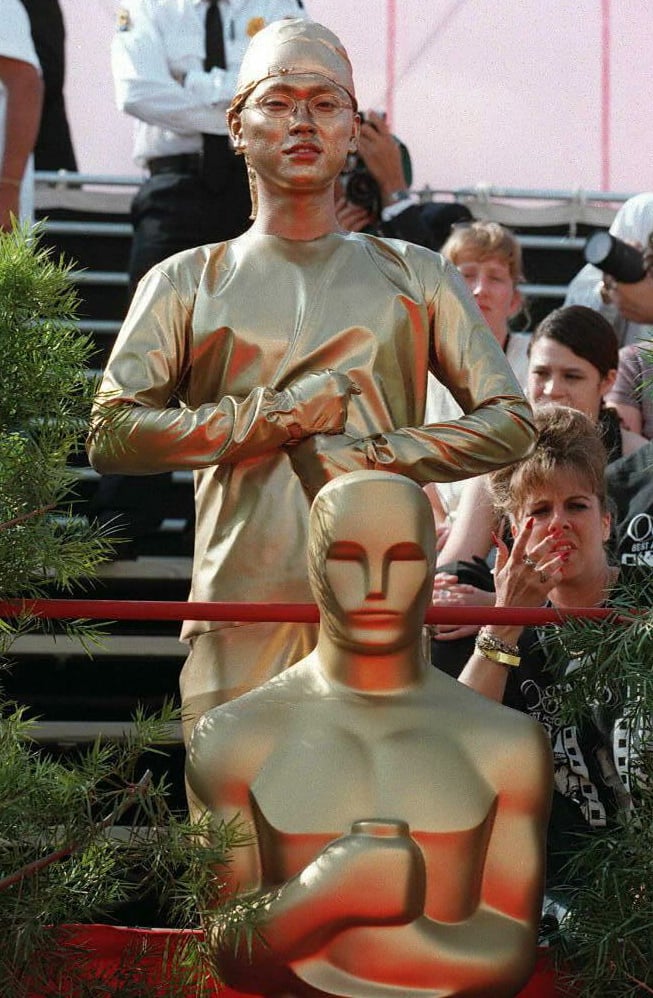 A Teenager Dressed Up as the Oscar Statue