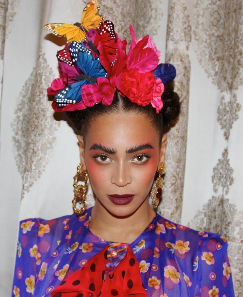 Of course, no Frida Kahlo costume roundup would be complete without an appearance from Beyoncé, who masterfully brought the Mexican artist's look to life a few years ago with a colorful frock, statement earrings, and braided 'do with flowers. If you'd prefer to skip penciling in Frida's signature unibrow, go for brushed up, exaggerated dark brows like Bey's.