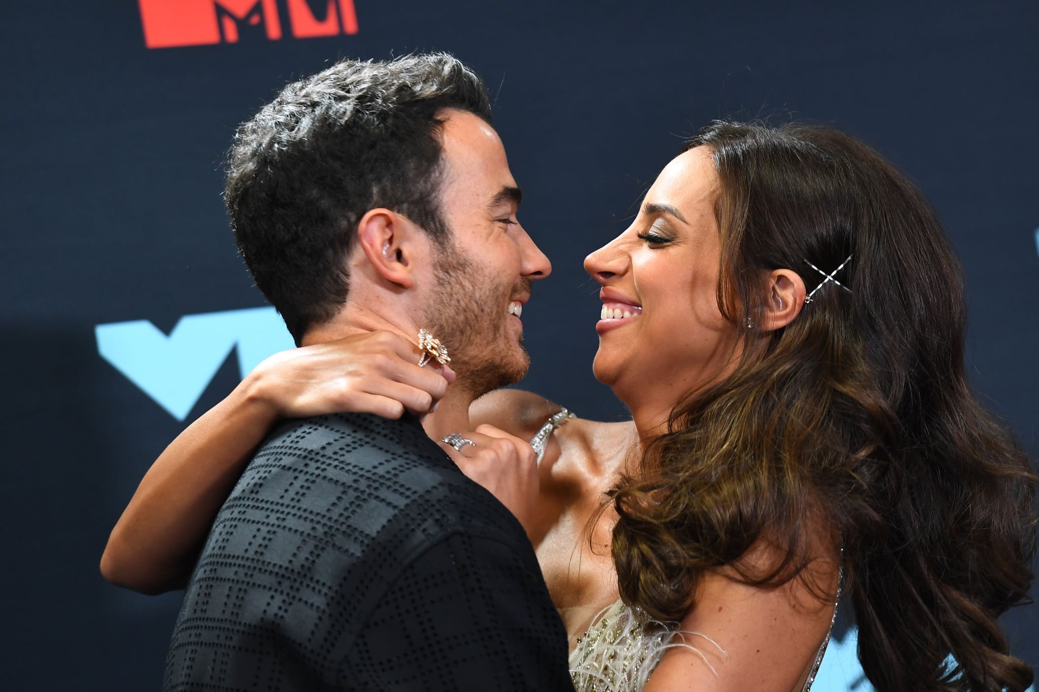 US musician Kevin Jonas (L) and wife Danielle Jonas pose in the press room during the 2019 MTV Video Music Awards at the Prudential Center in Newark, New Jersey on August 26, 2019. (Photo by Johannes EISELE / AFP)        (Photo credit should read JOHANNES EISELE/AFP via Getty Images)