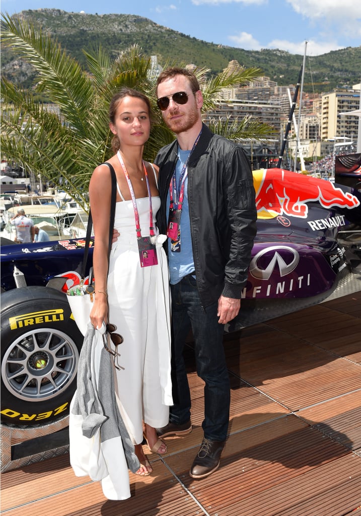 Vikander and Fassbender at the Monaco Grand Prix.
Few things better test one's ability to cope with life in the public eye than dating someone of even greater fame; Fassbender isn't just Vikander's future costar, but he's also reported to be her boyfriend. Vikander and Fassbender connected on the Australian set of  The Light Between Oceans, and after being photographed kissing by paparazzi, they made the big-in-Hollywood step of consenting to photos together while at the Monaco Grand Prix in May. The photos are likely the best and only confirmation curious minds will ever get of Vikander and Fassbender's relationship. 
"I love to talk about my films and my work, because it's so much excitement to promote a film when it's finally coming out and reunite with all the people you work with and all that," she said. "And then when it comes to the other part of the publicity, or being public, it's really hard to prepare for it, I think. And yet, we kind of know that it's a big part of what [actors] do. But I think if you choose wanting to be private, you can be that."