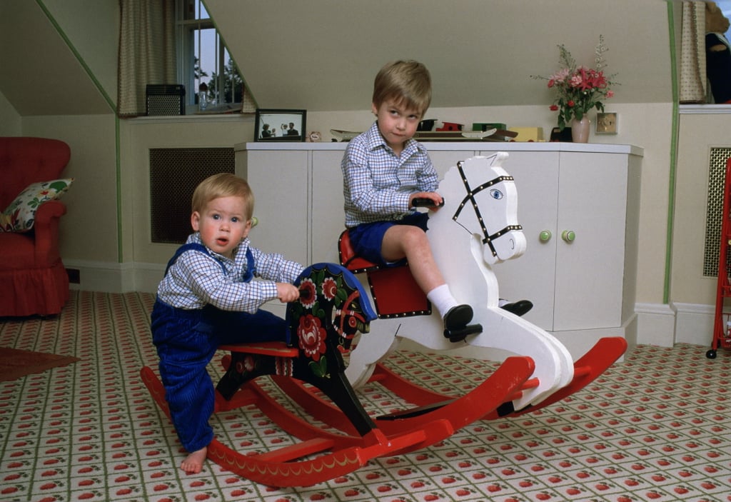 Prince William and Prince Harry played on their rocking horses at Kensington Palace together in October 1985.