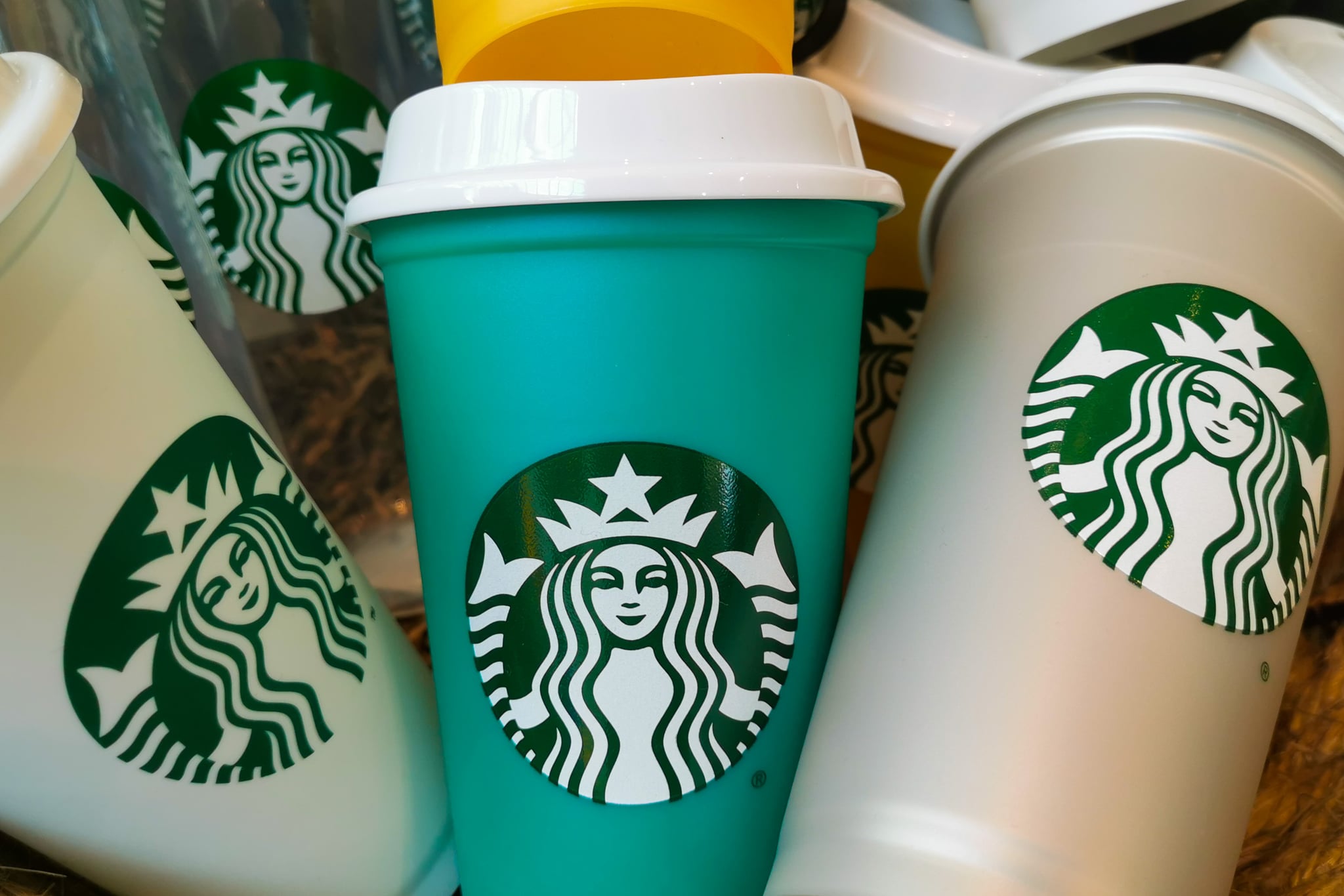 Reusabkle Starbucks cups are seen in Starbucks Coffee shop in Krakow, Poland on May 14, 2021. (Photo by Beata Zawrzel/NurPhoto via Getty Images)