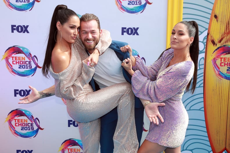 Nikki Bella, Artem Chigvintsev, and Brie Bella at the 2019 Teen Choice Awards