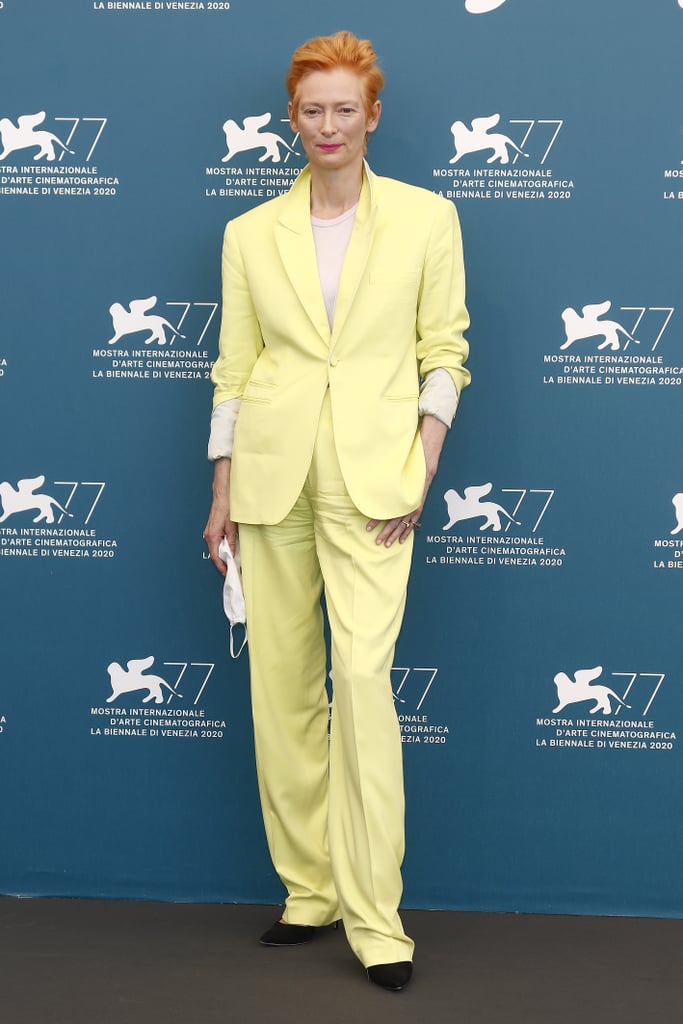 Tilda Swinton wore a citrus-colored suit to the photocall for The Human Voice.