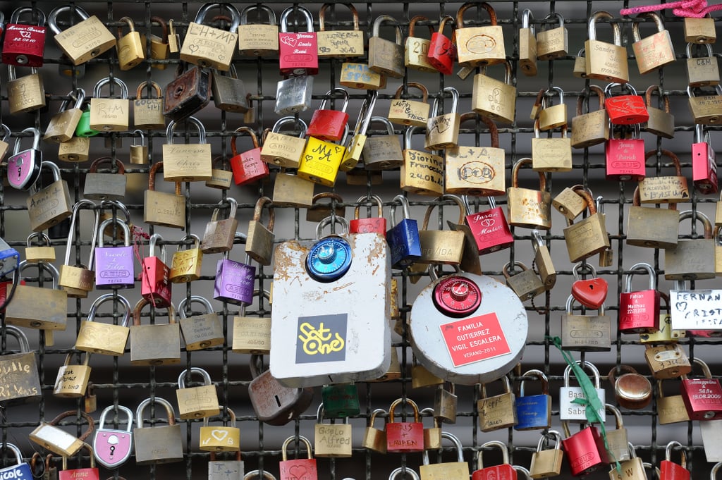 Liebesschloesser, or love padlocks, were affixed to a fence on Hohenzollernbruecke bridge in Cologne, Germany.
