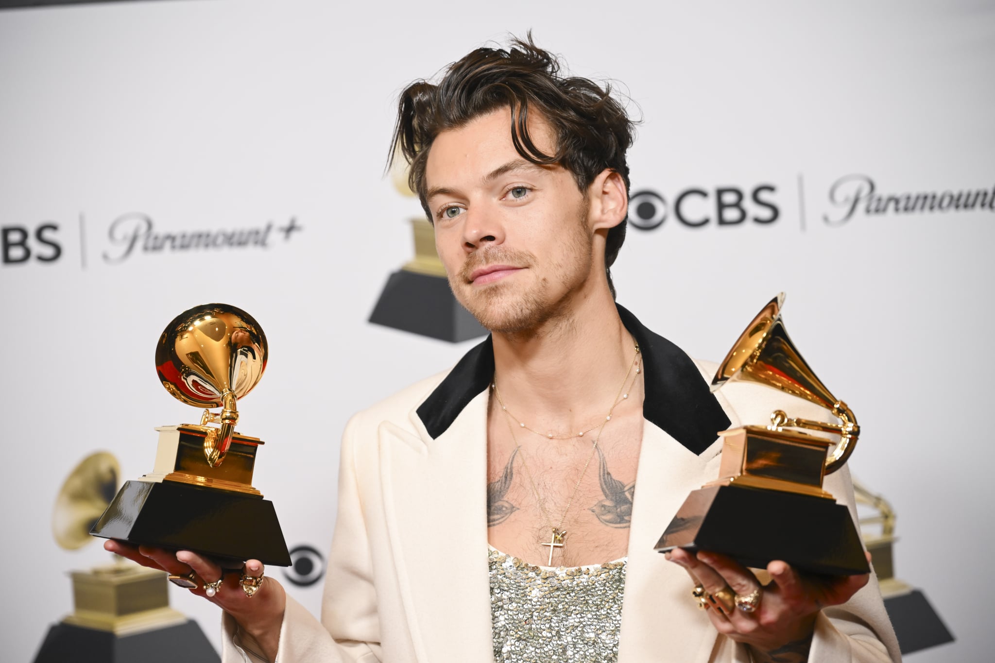 Harry Styles poses with his GRAMMY awards for Best Pop Vocal Album and Album of the Year for Harrys House in the Press Room at the 65th Annual GRAMMY Awards held at Crypto.com Arena on February 5, 2023 in Los Angeles, California. (Photo by Michael Buckner/Variety via Getty Images)