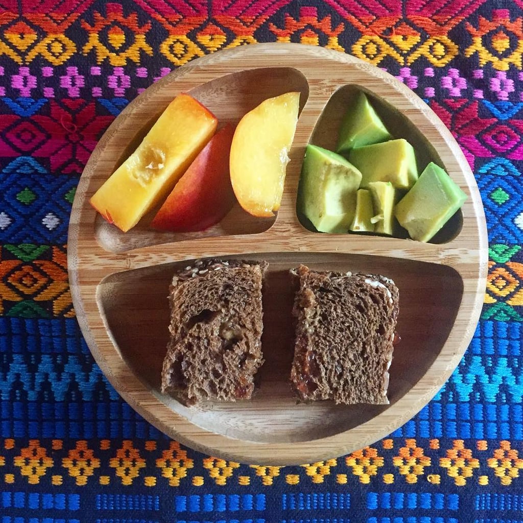 "Lunch: jam and almond butter sandwich on sprouted rye and sourdough bread, avocado, and nectarine."