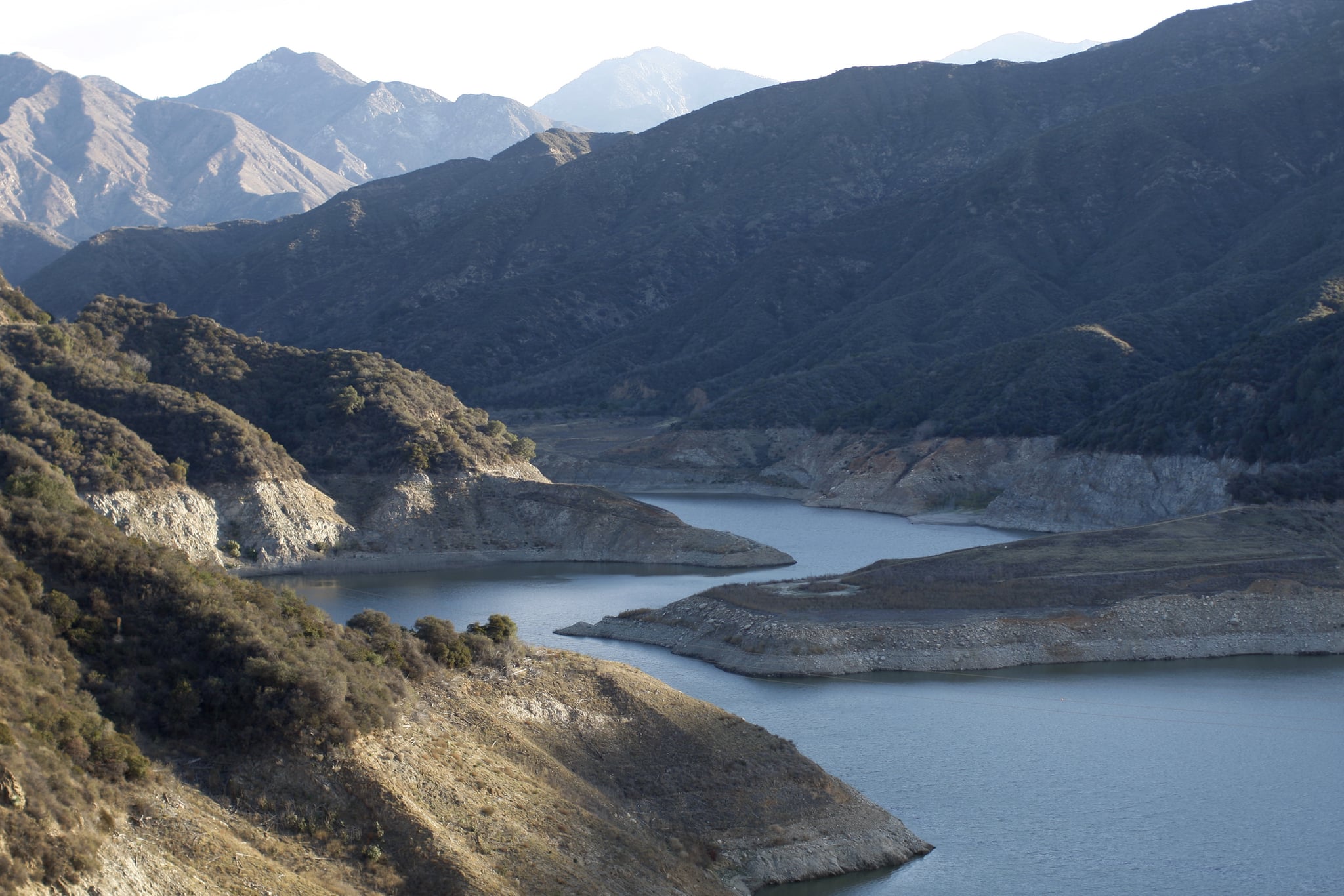 Rocky shores are exposed at the San Gabriel Reservoir near ...