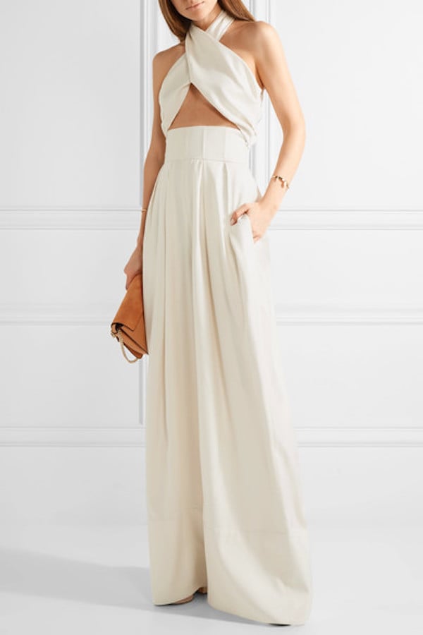 For a relaxed wedding at the beach, opt for this sophisticated ivory-hued Rosie Assoulin Artichoke Hearts Cutout Jumpsuit ($1,995). We can totally envision a bride wearing this with a flower crown or embellished headband.