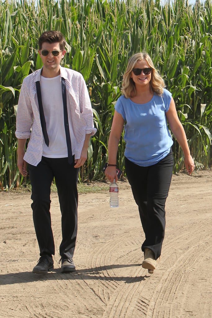 Adam Scott is looking casual as Ben, alongside Amy Poehler as Leslie.