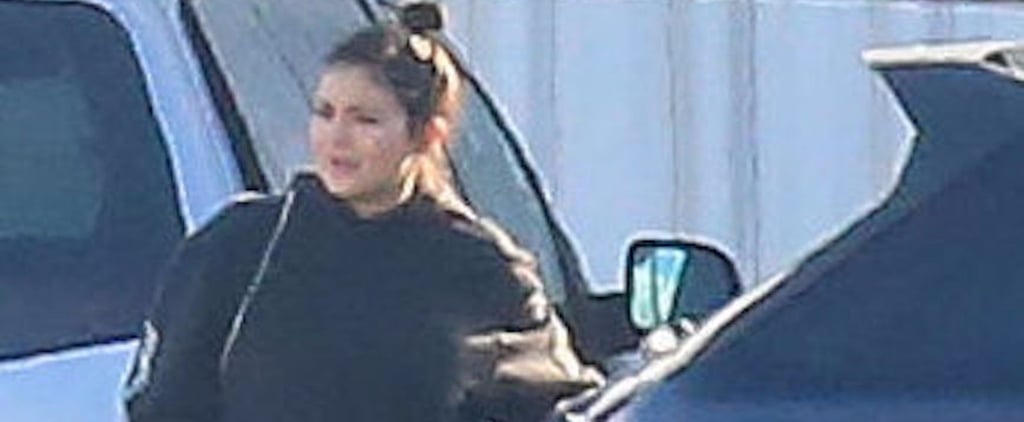 Kylie Jenner Keeps Her Growing Belly Under Wraps While Catching a Flight