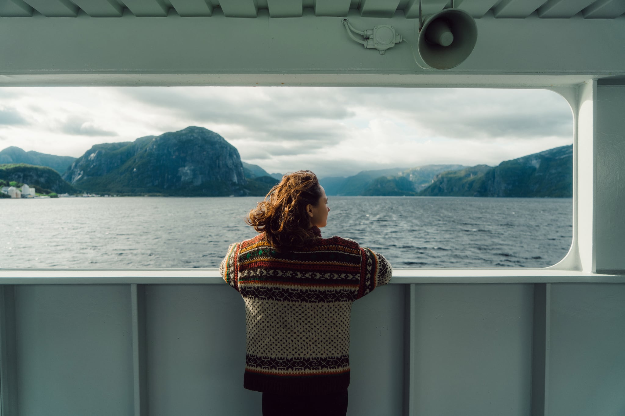 woman looking at scenic view from ferry in Norway