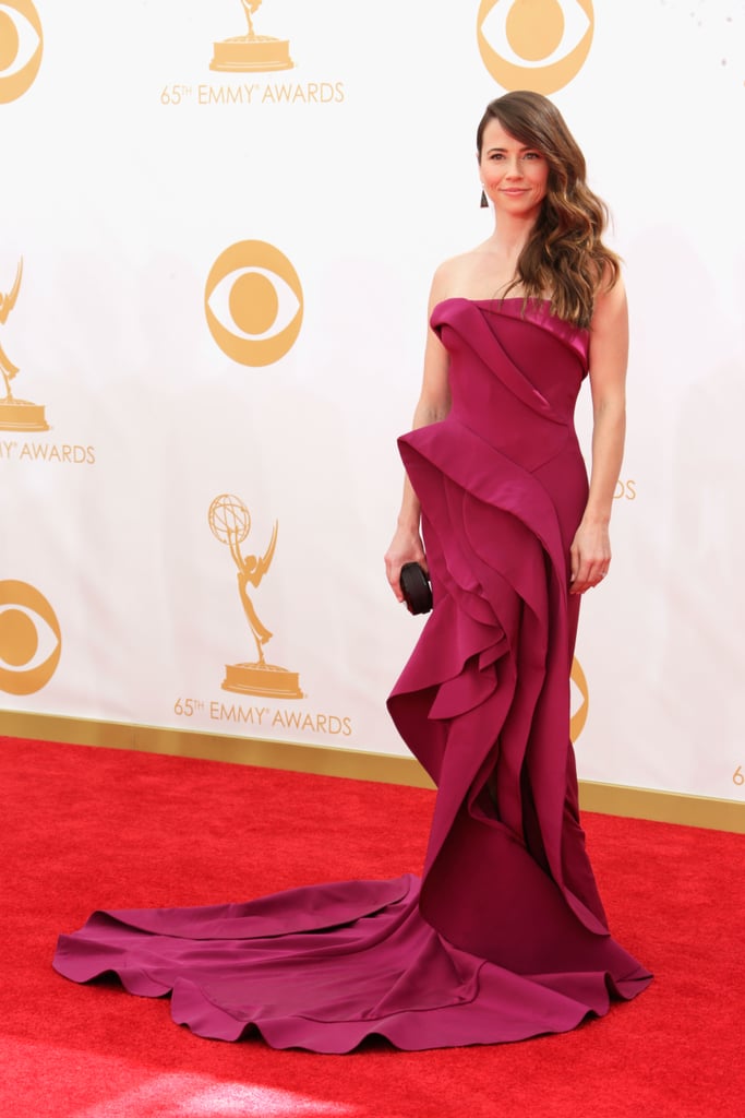 Ruffles ruled the night for Linda Cardellini, who picked a dramatic magenta Donna Karan Atelier gown. The dramatic look was finished off with Jimmy Choo shoes, Irene Neuwirth jewels, and a Rauwolf bag.