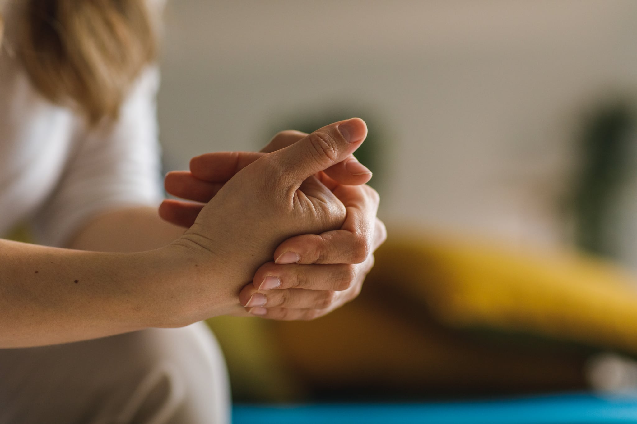 Close up shot of unrecognizable woman cracking her knuckles.