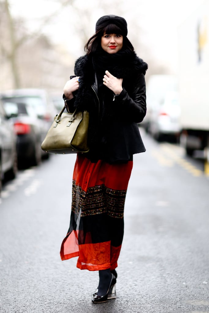 A breezy maxi got anchored with leather and fur, then finished with plexiglass wedges.
A breezy maxi got anchored with leather and fur, then finished with plexiglass wedges.
