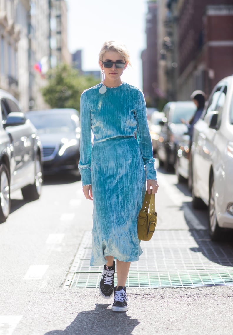 With a Long-Sleeve Velvet Dress and Contrasting Purse