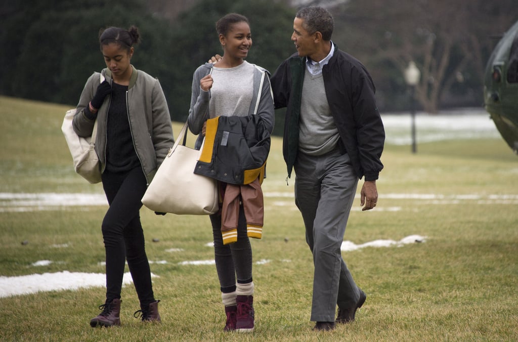 Barack chatted with his daughters after returning from their Hawaiian vacation in January 2014.