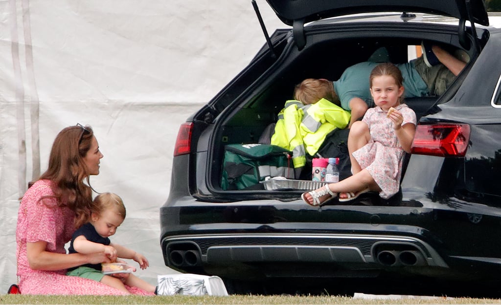 Charlotte, who couldn't care less, gets down on her food while Louis gets ready to dig in himself.