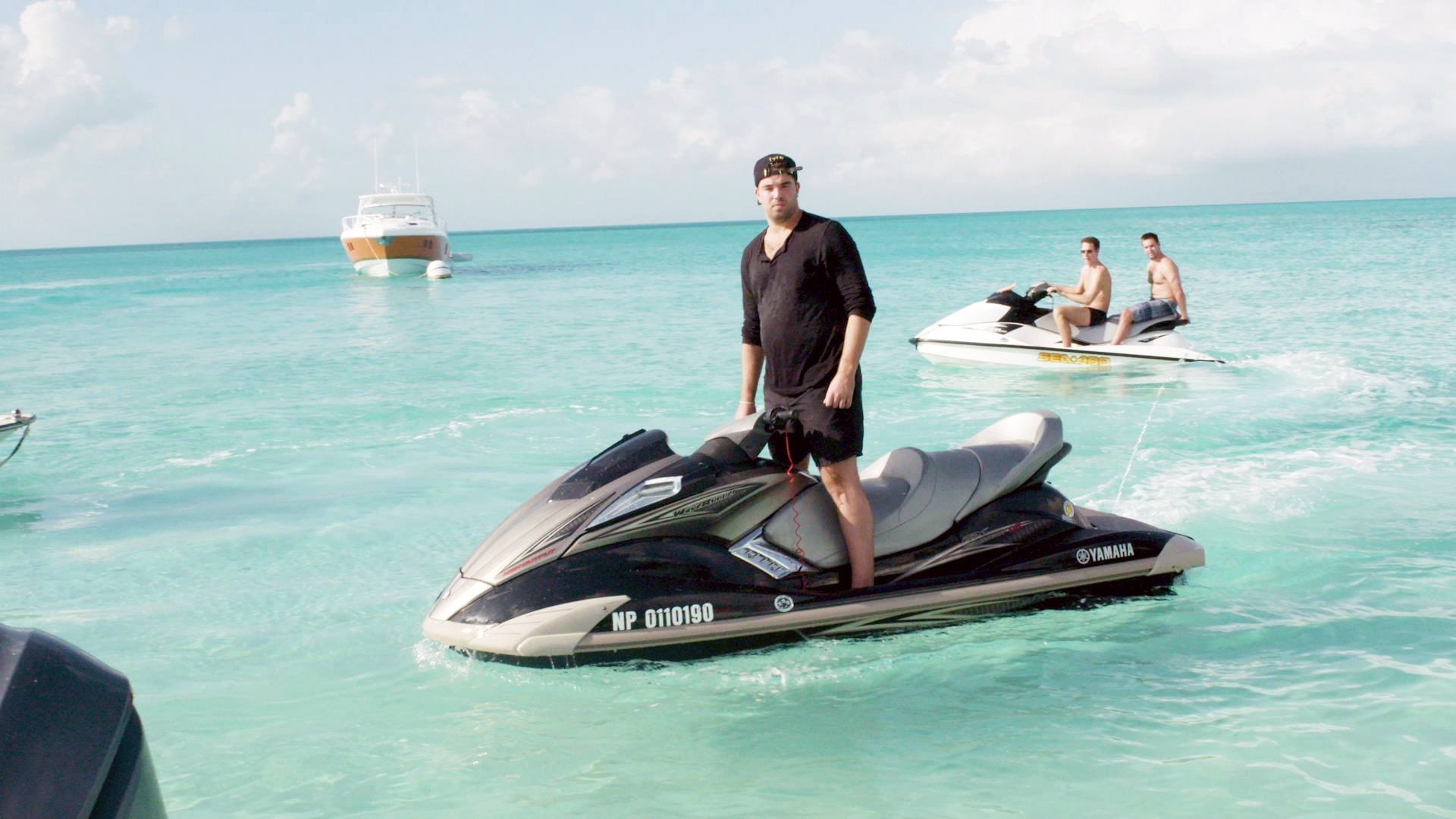 FYRE, Billy McFarland, founder of Fyre Media (on jet ski), 2019.  Netflix / courtesy Everett Collection