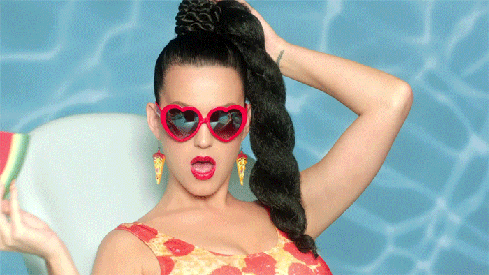 She shamelessly demonstrates her love of pizza.