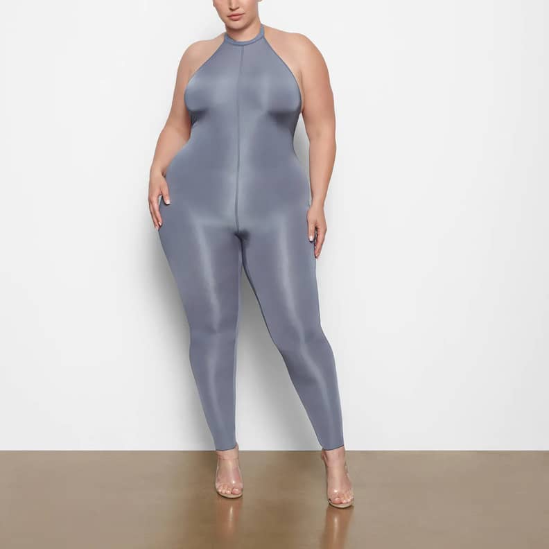 Khloe Kardashian in a Skims Black Jelly Sheer Full Bodysuit and