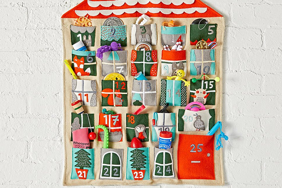 5. Use Activity-Based Advent Calendars as an Excuse to Plan Ahead
As a parent with young kids, you'll want to start all kinds of fun holiday traditions. But also as a parent with young kids, time moves quickly, and December will fly by. To make sure you have all the experiences on your family's wish list, create an activity-based Advent calendar (who needs kids hopped up on chocolate treats every day, anyway?). At some point before Dec. 1, sit down and plan out one activity, big or small, for each day. Sure, some days can (and should, for your sanity) be as simple as "read The Night Before Christmas" or "sing 'Jingle Bells,'" but it's a smart way to schedule — and thus plan for — more substantial excursions or activities. That means setting dates for when you plan to ride your city's holiday train or visit Santa Claus at the library as well as the afternoons you intend to make an ornament craft or bake cupcakes for school. By committing those things to the calendar, they'll more likely happen . . . and won't creep up on you at the eleventh hour. 
6. Prepare For Each Week Every Sunday
You did the hard work of arranging 25 days of holiday Advent calendar fun. Now you just need to remember to stick to your plan. Once a week, review the upcoming seven days and make sure, say, your grocery list is updated with the ingredients you'll need for Thursday night's hot cocoa making and tickets are procured for Sunday's excursion to the zoo's light display.
