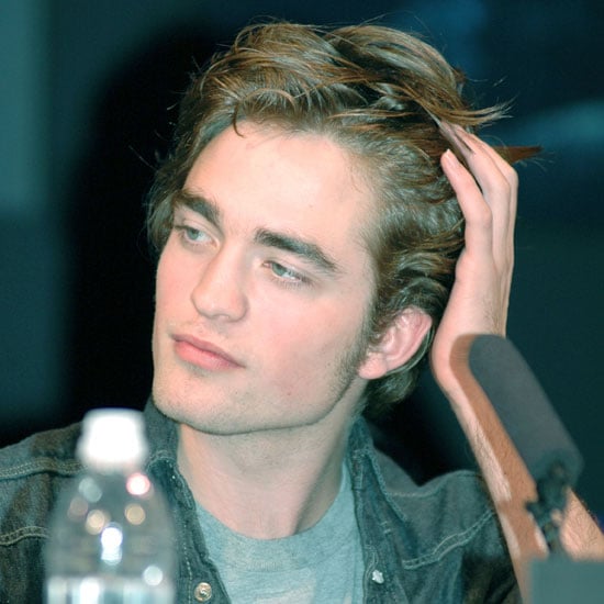 He pushed back his untamed locks at the November 2005 Harry Potter Tokyo press conference.