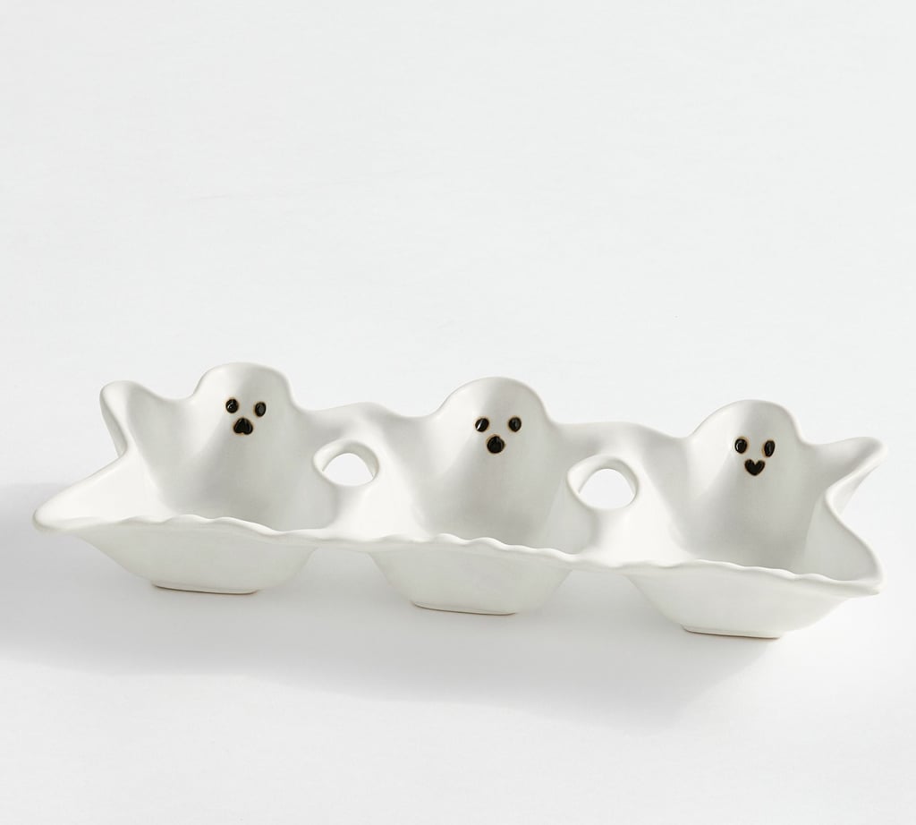 Pottery Barn Gus the Ghost Stoneware Multi-Condiment Server ($47, originally $59)
Halloween snack serving just got easier thanks to this ghost multi-condiment server. The platter features three bowls that can serve a group of tiny snacks or condiments. The three food-safe bowls truly lend a helping hand and look good while doing so!