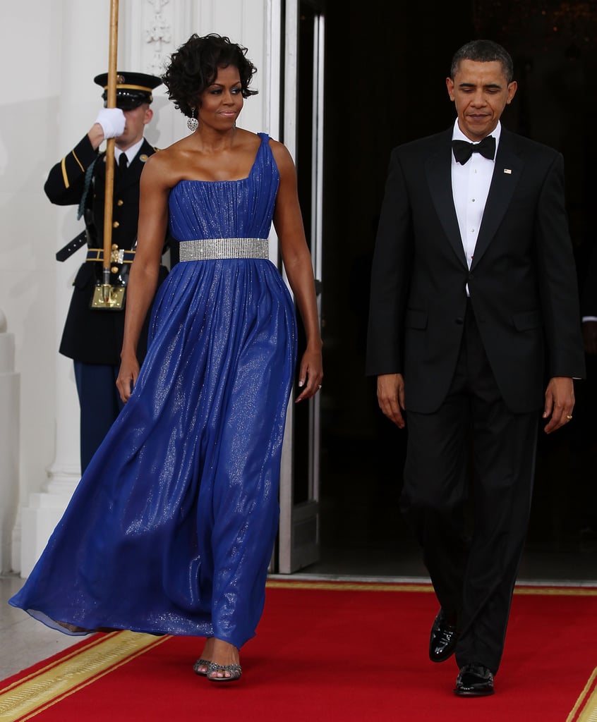 Michelle wearing a one-shoulder Peter Soronen gown at a state dinner in 2010.