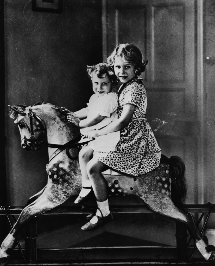 Elizabeth and Margaret posed on a rocking horse together in 1932.