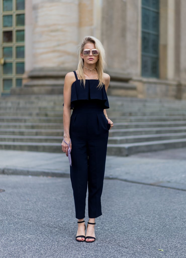 A simple black jumpsuit with strappy sandals