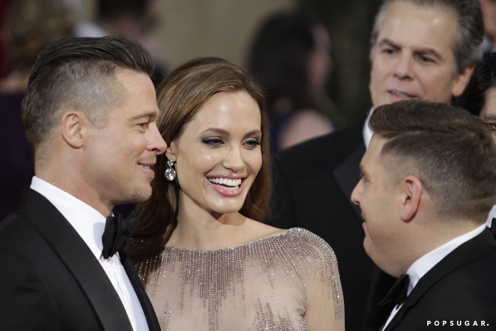 Brad Pitt and Angelina Jolie stopped to chat with Jonah Hill on the red carpet.