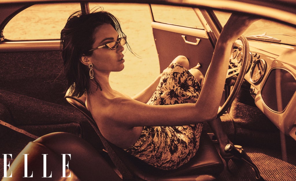 Kendall is wearing a Miu Miu dress with Manolo Blahnik pumps, Poppy Lissiman sunglasses, and Harry Winston earrings.