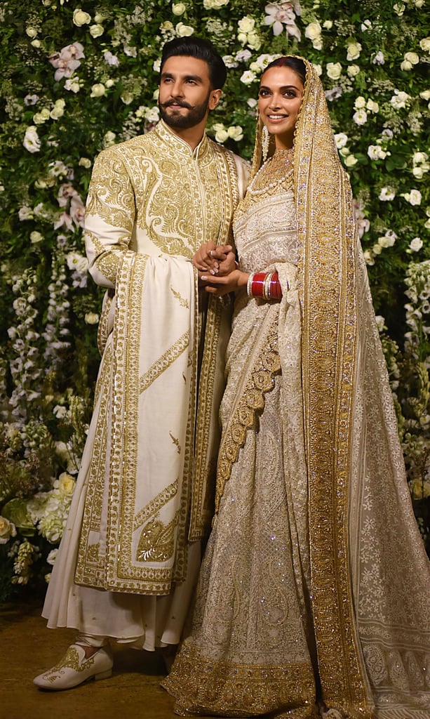 For their reception in Mumbai, Deepika wore a breathtaking white and embroidered ensemble that had a long train.