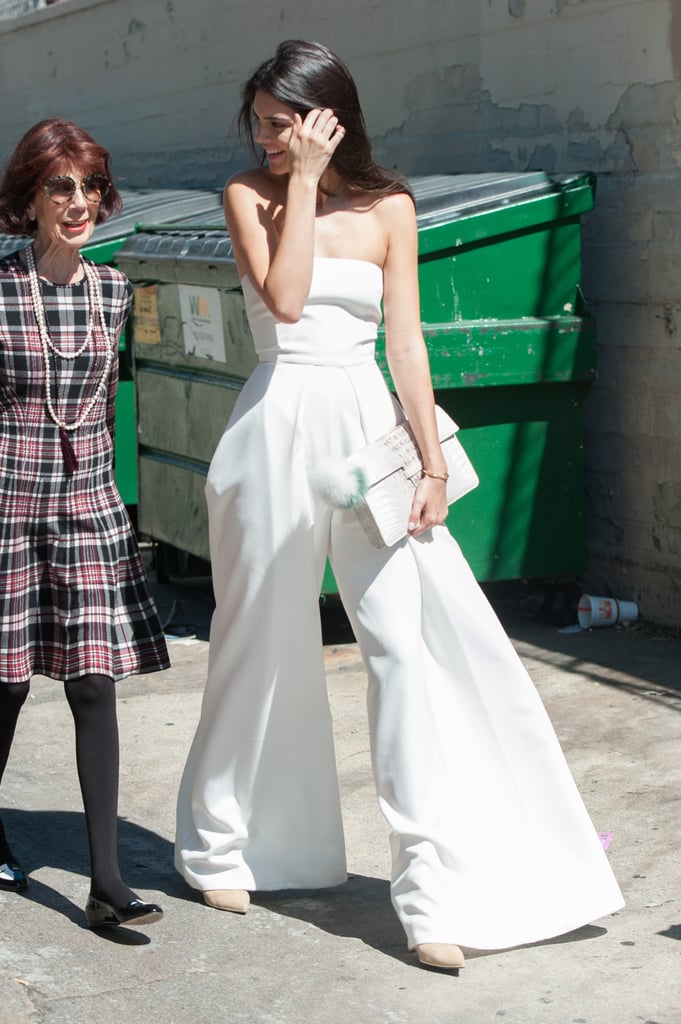 Kendall chose a strapless wide-leg jumpsuit for the outing. Her crocodile Adriana Castro clutch and neutral pumps were the perfect accessories, and her Fendi keychain made for a fun touch.