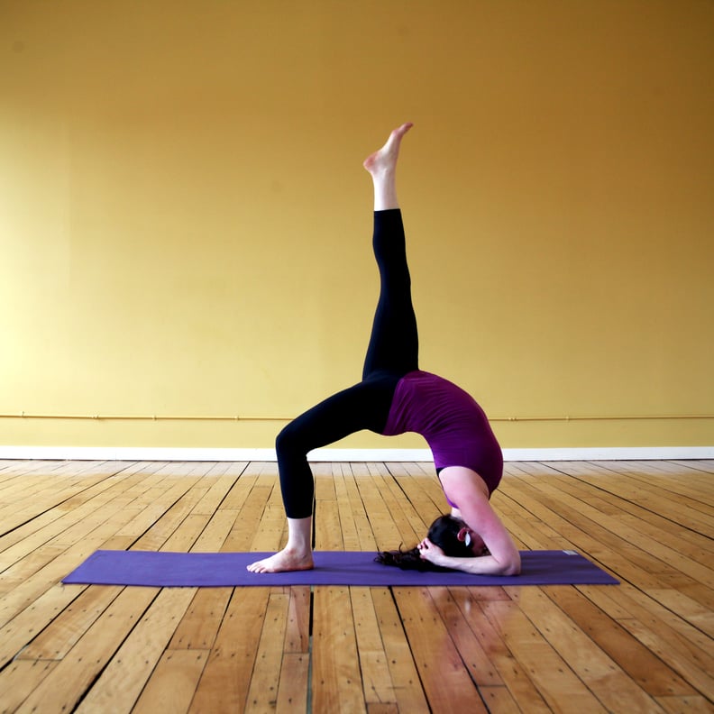 difficult advanced yoga pose by attractive female, on white