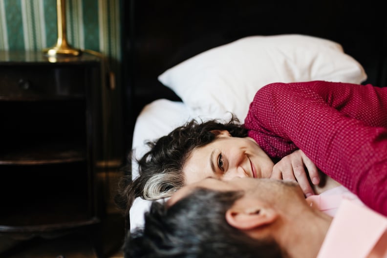 Couple Looking at Each Other in Bed 