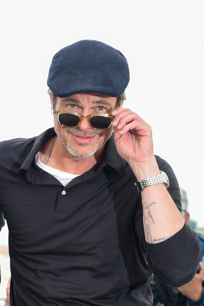Brad got cute for the cameras during a photocall in Cannes.