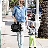 Miranda Kerr spent a sunny afternoon with Flynn in Hollywood in a denim-on-denim look. She jazzed up her look with a studded bag and snazzy accessories, including glittery gold sunglasses and velvet loafers, both by Miu Miu.