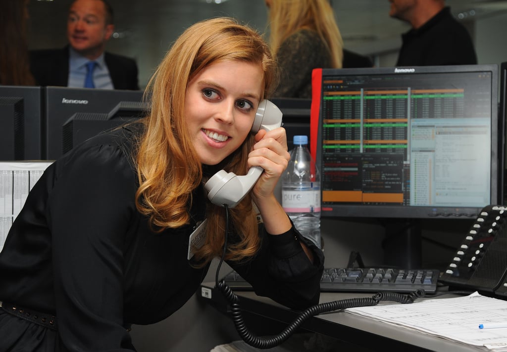 Answering the phones during a charity event in London in 2014.