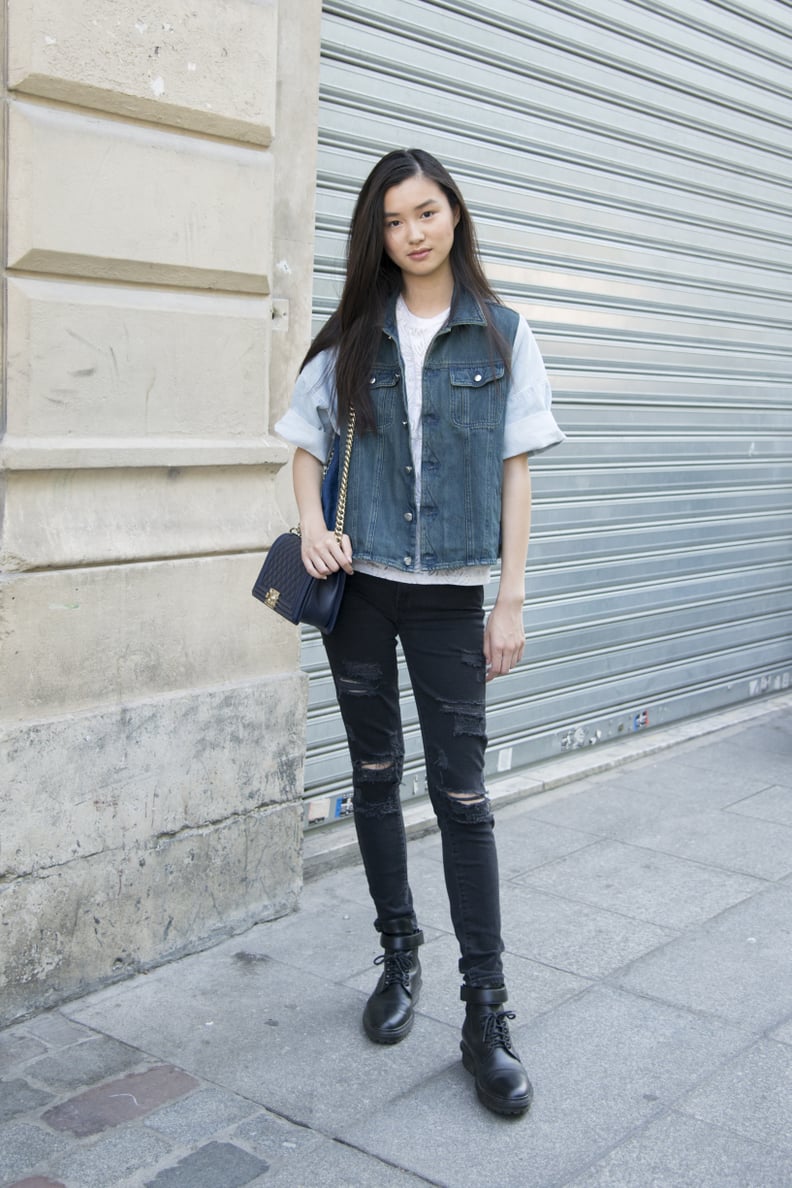 A Denim Vest and Distressed Black Jeans