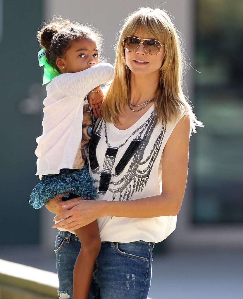 Heidi Klum held her daughter Lou during a fun-packed day in LA that included a soccer game.