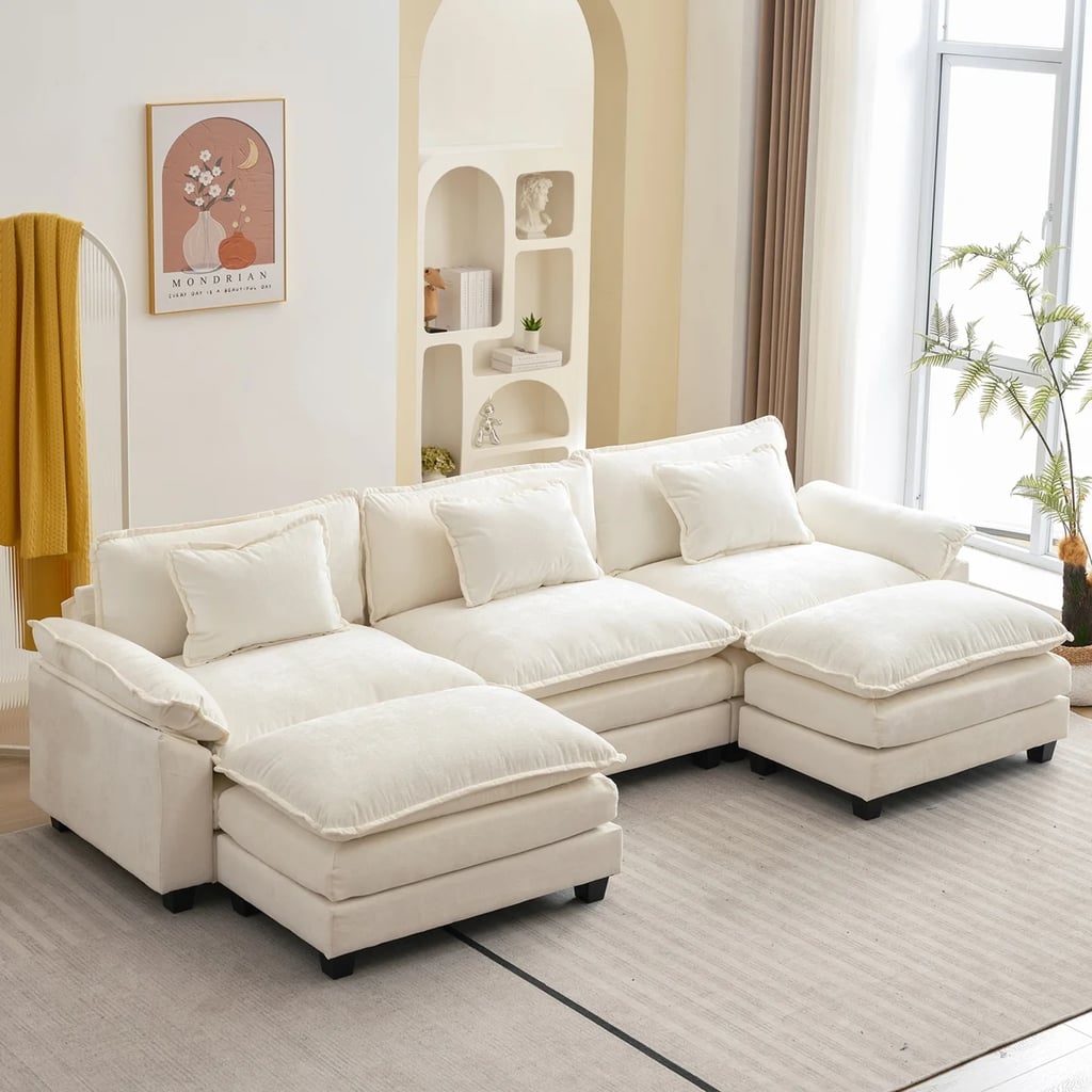 Latitude Run Praylow 120" W Modular U-Shaped Sectional Sofa with Two Ottomans ($800, originally $890)
If you are looking for a couch that feels more like a cloud, this sectional is for you. With built-in pillow armrests, double cushions, and matching accent pillows, this sofa is made to let your body sink in. Consider this the perfect companion to a movie marathon or your frequent couch naps.
What we love:

This design is ideal for those who like to sink into their couches. 
The fabric is pet friendly.

Who it's best for:

The deep double cushions are made of high density foam for an ultra-soft seat.
The sectional seats up to five people with a variety of options thanks to the two ottomans.

Who should avoid it:

With so many cushions this might be considered too soft for those who prefer a firmer finish. 
Assembly is estimated to take over 30 minutes. 

The Details: Width: 120" | Height: 34.6" | Depth: 57" | Upholstery: Chenille | Color Options: 8
