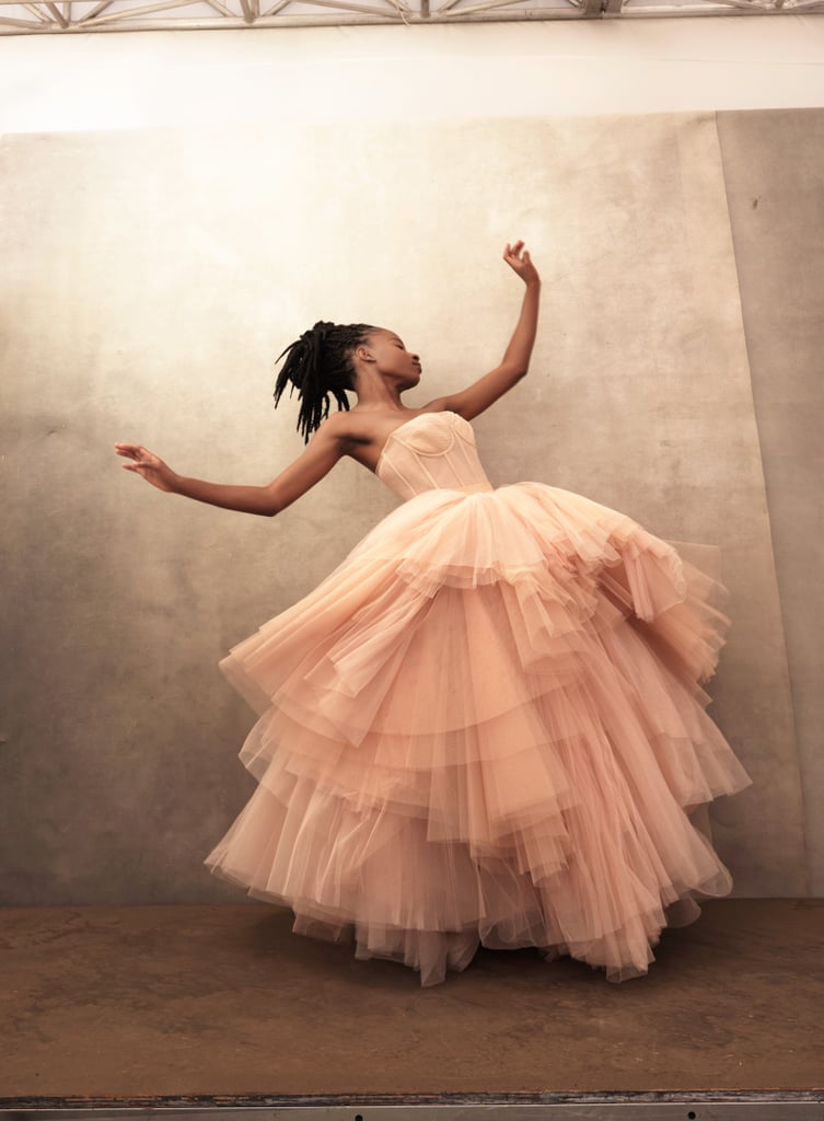 Wearing an Alexander McQueen dress. Wearing an Alexander McQueen dress.
